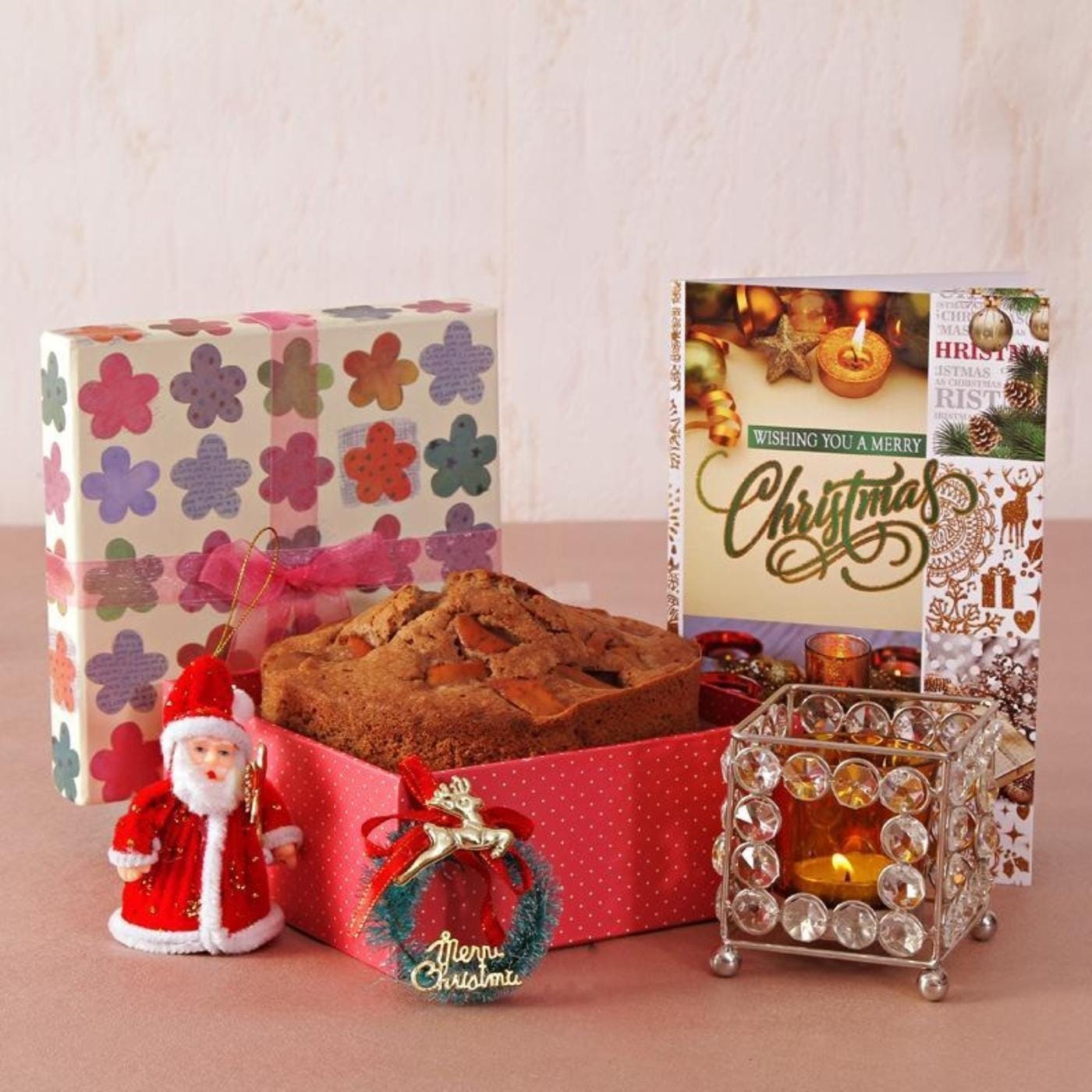 apple cinnamon cake with crystal votive and christmas decor in