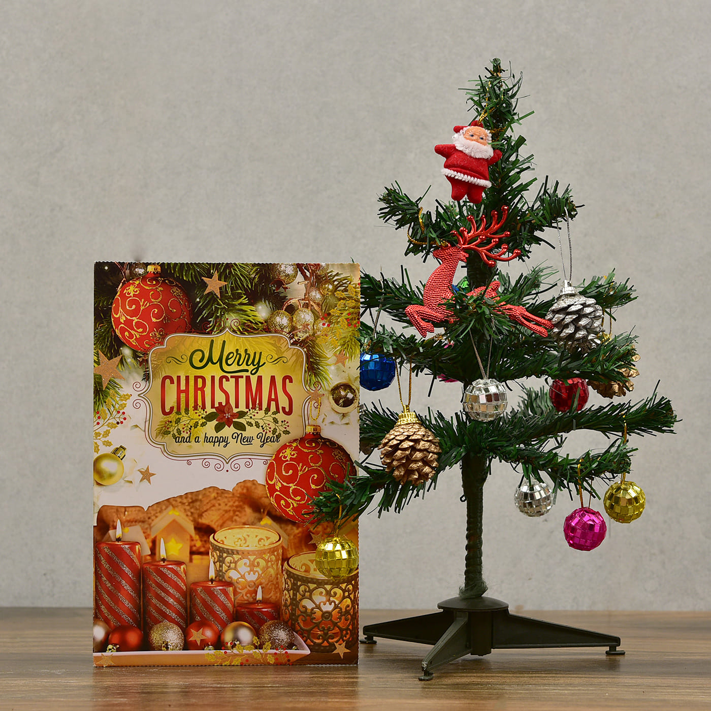 christmas tree with decorative item and greeting card
