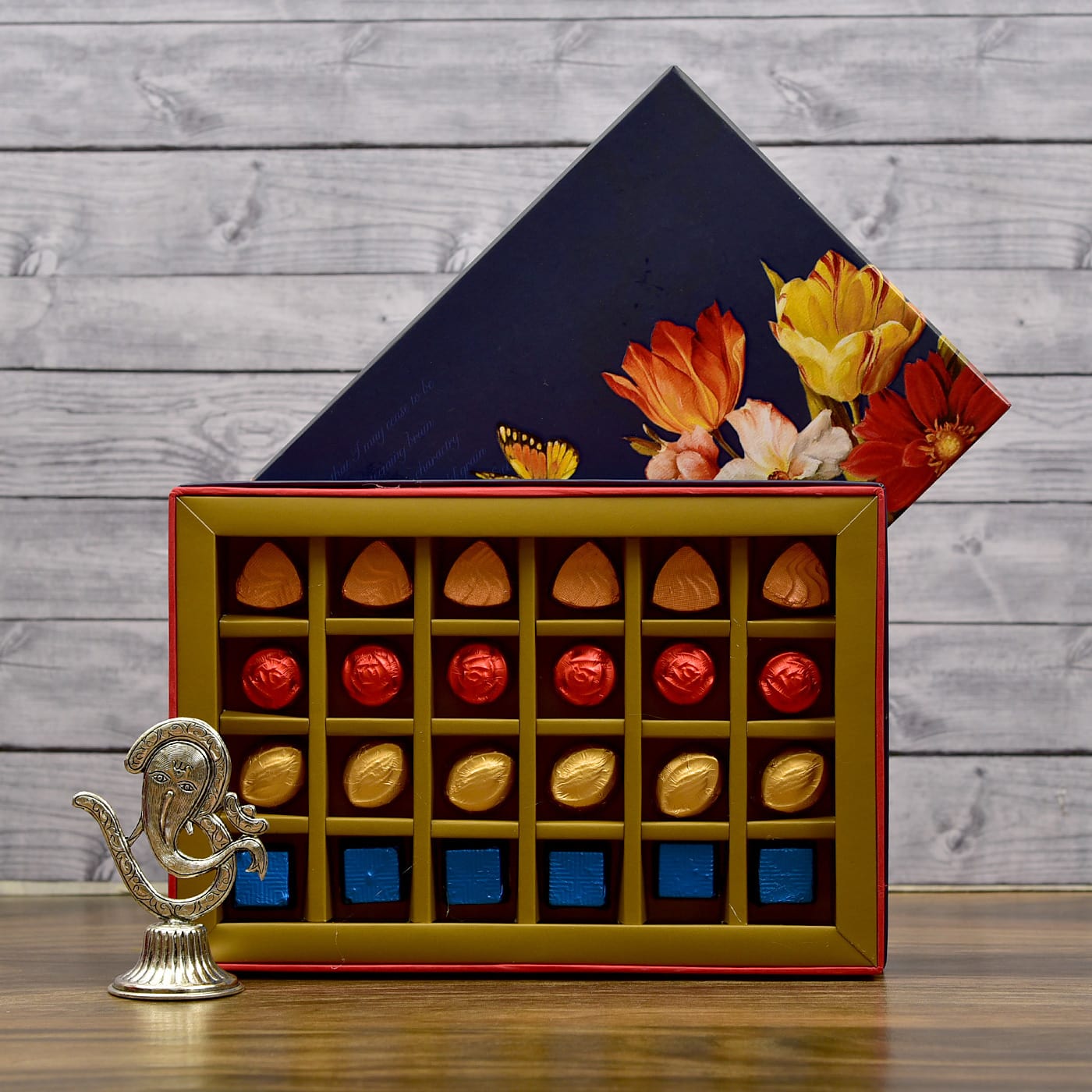 ganesha showpiece with assorted chocolate box: gift/send gourmet
