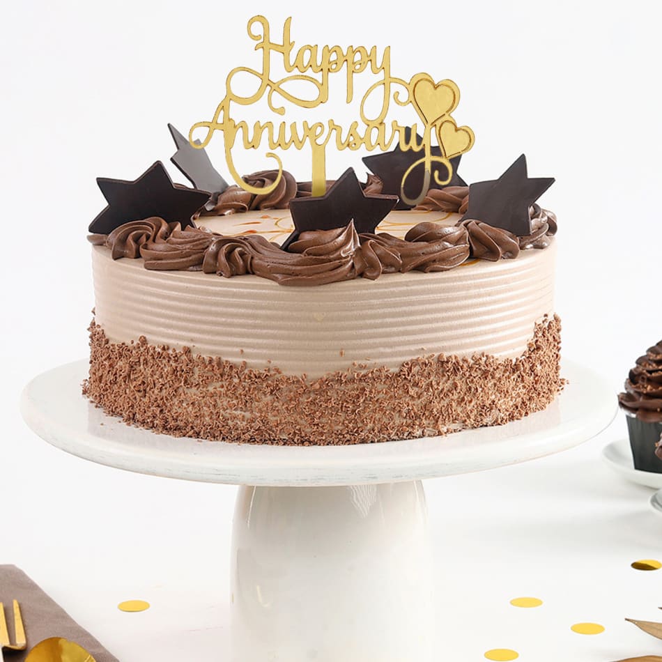 Celebrating wedding anniversary with heart shape chocolate cake Stock Photo  - Alamy