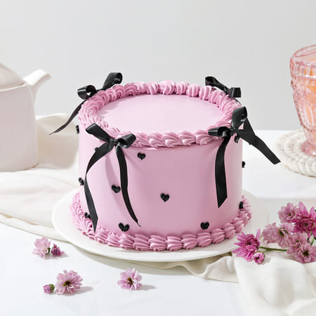 Layers And Bow Cream Cake