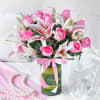 Buy Beautiful 13 Pink Roses & 3 Lilies in a Glass Vase with Round Black Forest Cake