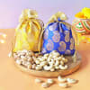 Buy Dry Fruits In Potlis And Diyas With Bamboo Plant