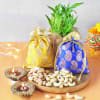 Dry Fruits In Potlis And Diyas With Bamboo Plant Online