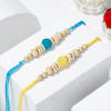 Gift Elegant Pearl Rakhi And Healthy Delights Hamper