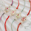 Gift Exquisite Kundan Pearl Rakhi Set Of 4 With Kaju Katli