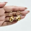 Buy Fancy Golden Ring and Animal Print Pom Pom Earring