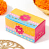Shop Floral Cutwork Rakhi With Besan Laddus
