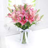 Gift Glass Vase of 10 Pink Lilies with Chocolate Cake (Half Kg)