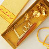 Buy Gold Plated Artificial Rose with Love Stand