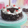 Gift Half Kg Black Forest Cake with a Bunch of 12 Pink Roses
