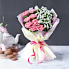 Gift Hazelnut Crunch Cake With Bunch Of Light Carnations