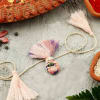 Pink And Lavender Potli Seed Rakhi Online