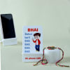 Quirky Meena Rakhi With Phone Stand Online