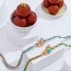 Radiant Peacock Motif Rakhi Duo With Gulab Jamun Online