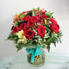 Red roses and seasonal flowers in vase Online