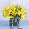 Buy Rudraksh Rakhi With Lilies In Vase