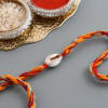Gift Seashell Moli Rakhi With Premium Dragees