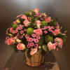 Seasonal flowers in a wooden vase Online