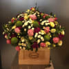 Seasonal flowers in wooden vase Online