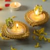 Gift Set of 2 Designer Ganesha Diya with Mewa Bites (250 gms)