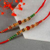 Gift Set of 2 Rakhis with Almond & Mishri and Silver Plated Roli Chawal Plate in Potli