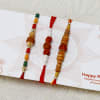 Buy Set of 3 Rakhis with 16 Pcs Ferrero Rocher Box & 250g Kaju Katli