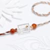 Silver-Plated Peacock Feather Rakhi Online