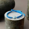 Sky Blue String Evil Eye Bracelet Rakhi Online
