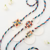 Striking Multicoloured Pearl And Meena Work Rakhi Set Of 3 Online