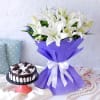 White Lilies Arrangement in Blue Wrapping with Black Forest Cake (Half Kg) Online