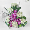 Buy White Roses and Orchids in Cane Basket with Teddy Bear