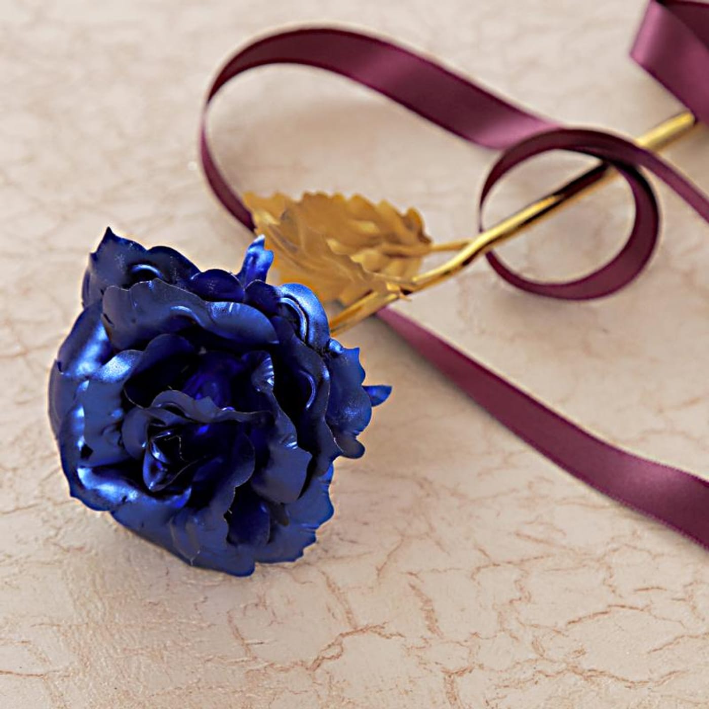 gold plated rose with blue petals