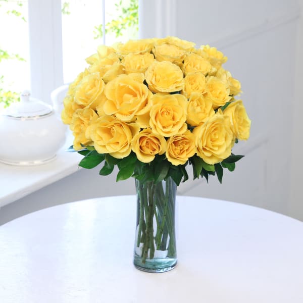 25 Yellow Roses in a Glass Vase