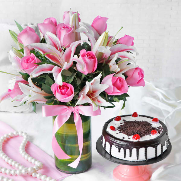 Beautiful 13 Pink Roses & 3 Lilies in a Glass Vase with Round Black Forest Cake