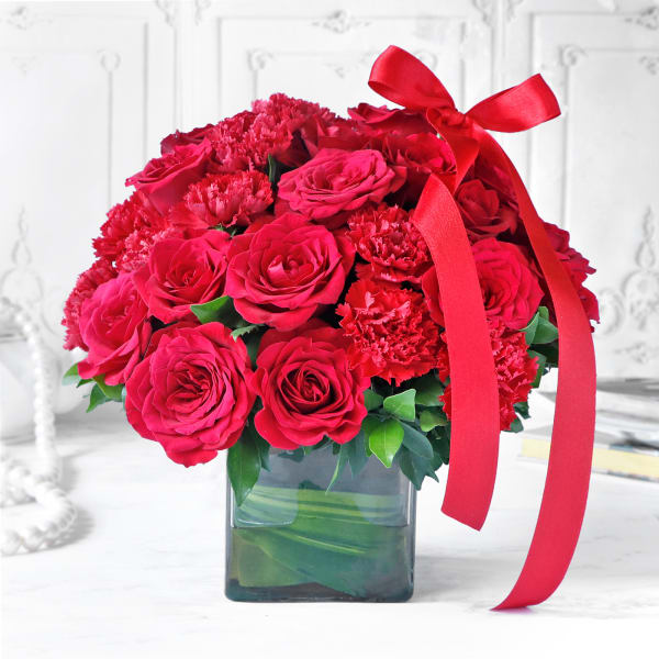 Bouquet of Red Carnations & Roses in Square Vase