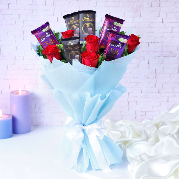 Bunch Of Vibrant Red Roses With Assorted Chocolate Bars