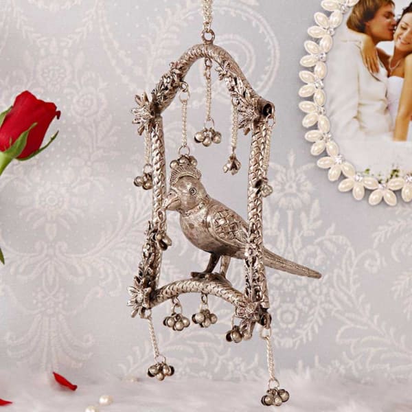 Carved Oxidised White Metal Swinging Parrot Wind Chime