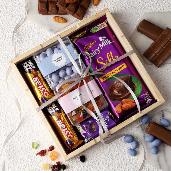 Chocolates And Dragees In Wooden Tray