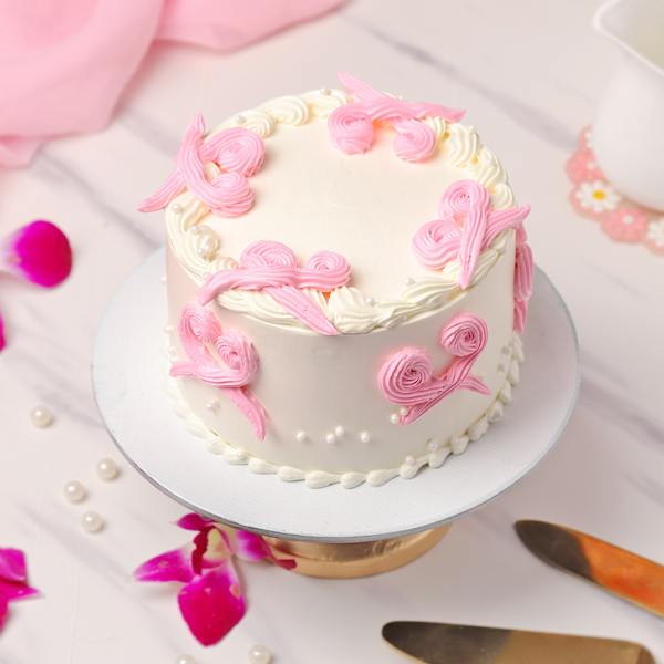 Elegant Pink Swirl Cream Cake