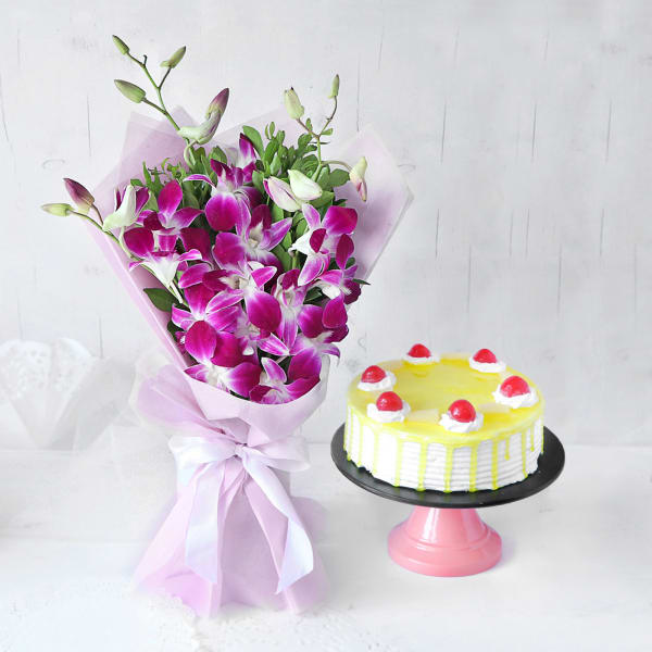 Elegant Purple Orchids Ribbon Bouquet with Pineapple Cake (Half Kg)