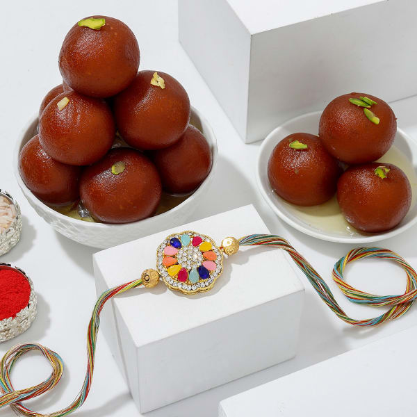 Enchanting Navratna Rakhi And Gulab Jamun Combo