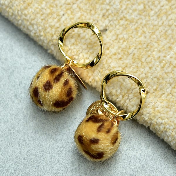 Fancy Golden Ring and Animal Print Pom Pom Earring