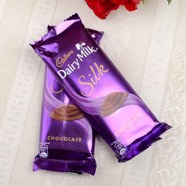 Order Heart Shaped Basket of 60 Red Roses with Card & 2 Dairy Milk Silk