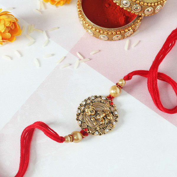 Lord Krishna Rakhi with CZ Stones & Golden Pearls