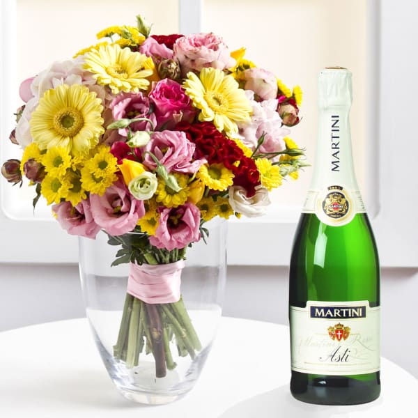 Mixed colorful bouquet and sparkling wine