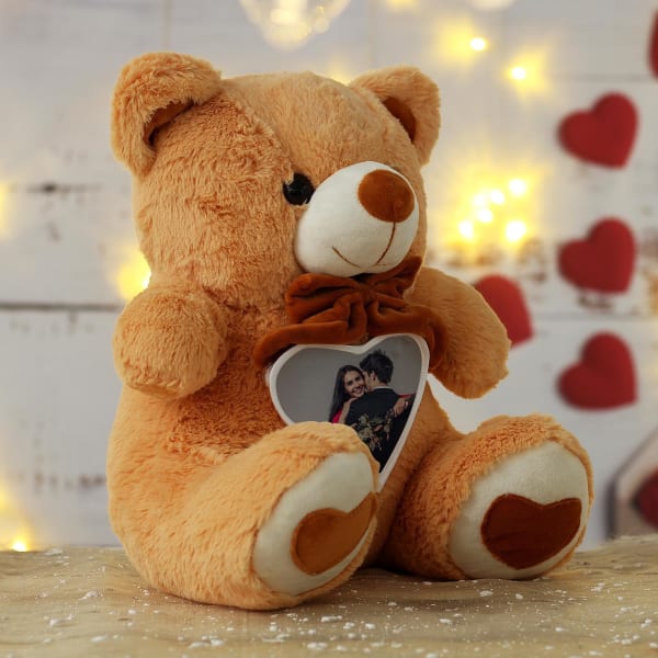 teddy bear holding chocolate