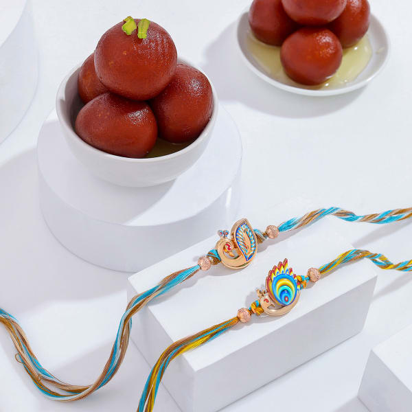 Radiant Peacock Motif Rakhi Duo With Gulab Jamun