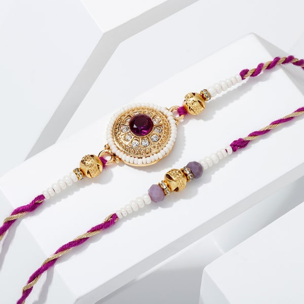 Regal Purple Stone And Pearl Rakhi - Set Of 2