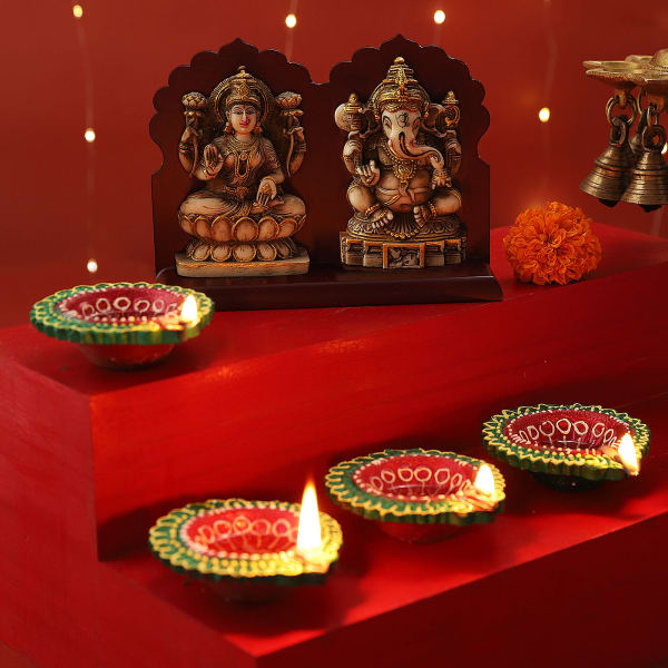 Set of 4 Clay Diya with Maa Laxmi & Lord Ganesha Idols